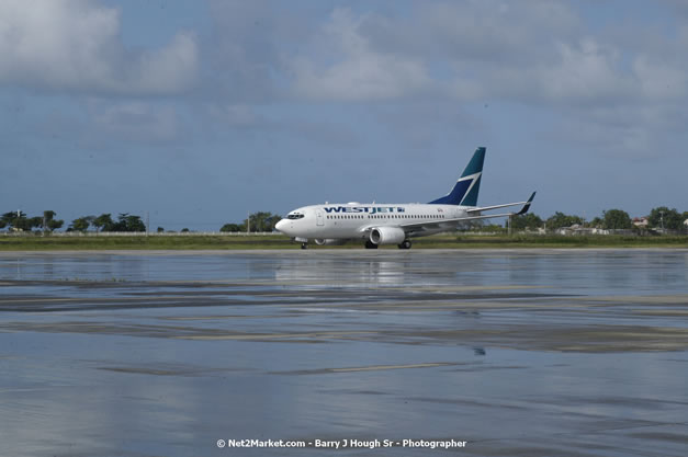 MBJ Airports Limited Welcomes WestJet Airlines - Inaugural Scheduled Service From Toronto Pearsons International Airport - Monday, December 10, 2007 - Sangster International Airport - MBJ Airports Limited, Montego Bay, Jamaica W.I. - Photographs by Net2Market.com - Barry J. Hough Sr, Photographer - Negril Travel Guide, Negril Jamaica WI - http://www.negriltravelguide.com - info@negriltravelguide.com...!