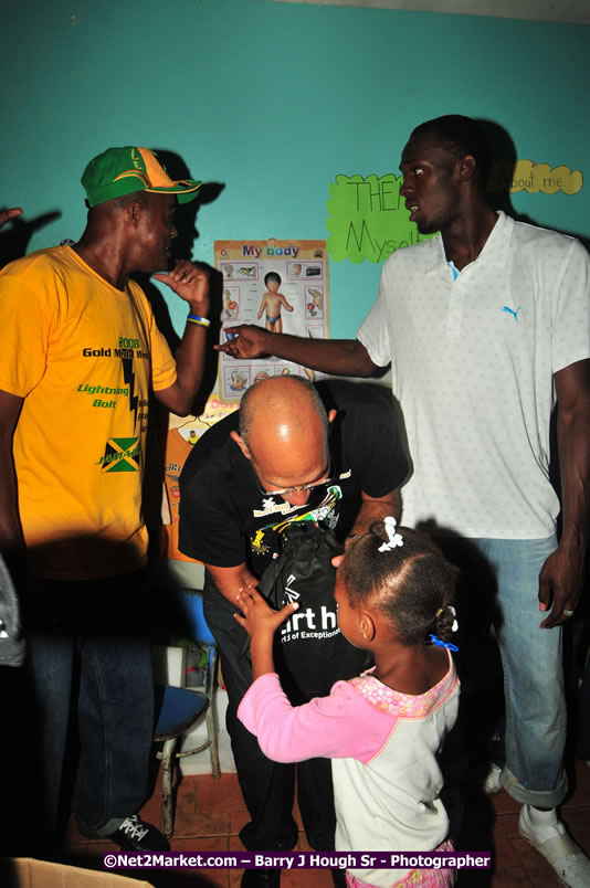 Usain Bolt of Jamaica - The Fastest Man In The World  - Usain Bolt Homecoming Celebrations - Press Conference at the Grand Bahia Principe &amp; Sherwood Content - Waldensia Primary School - Photographs by Net2Market.com - Barry J. Hough Sr. Photojournalist/Photograper - Photographs taken with a Nikon D300 - Negril Travel Guide, Negril Jamaica WI - http://www.negriltravelguide.com - info@negriltravelguide.com...!